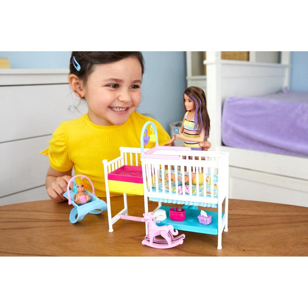 Scene of a little girl smiling while plying with the nursery set.