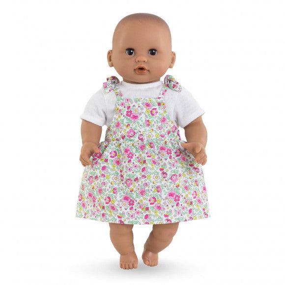 The dress is shown being worn by a doll
