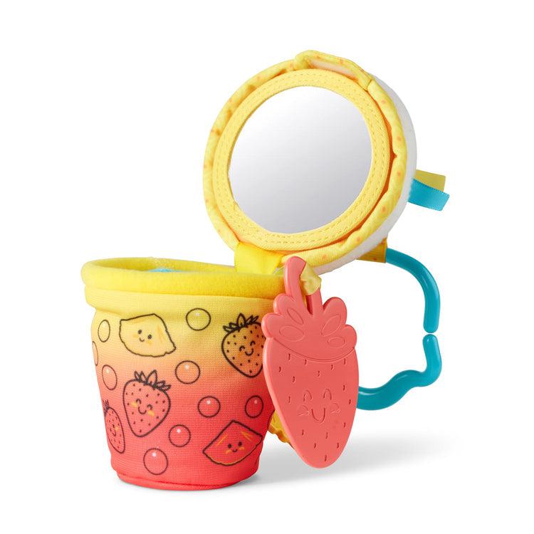 Inside view of toy | Whipped cream lid opens to reveal small circular mirror on bottom | inside of cup is lined with blue fabric and empty to hold plastic strawberry and pineapple