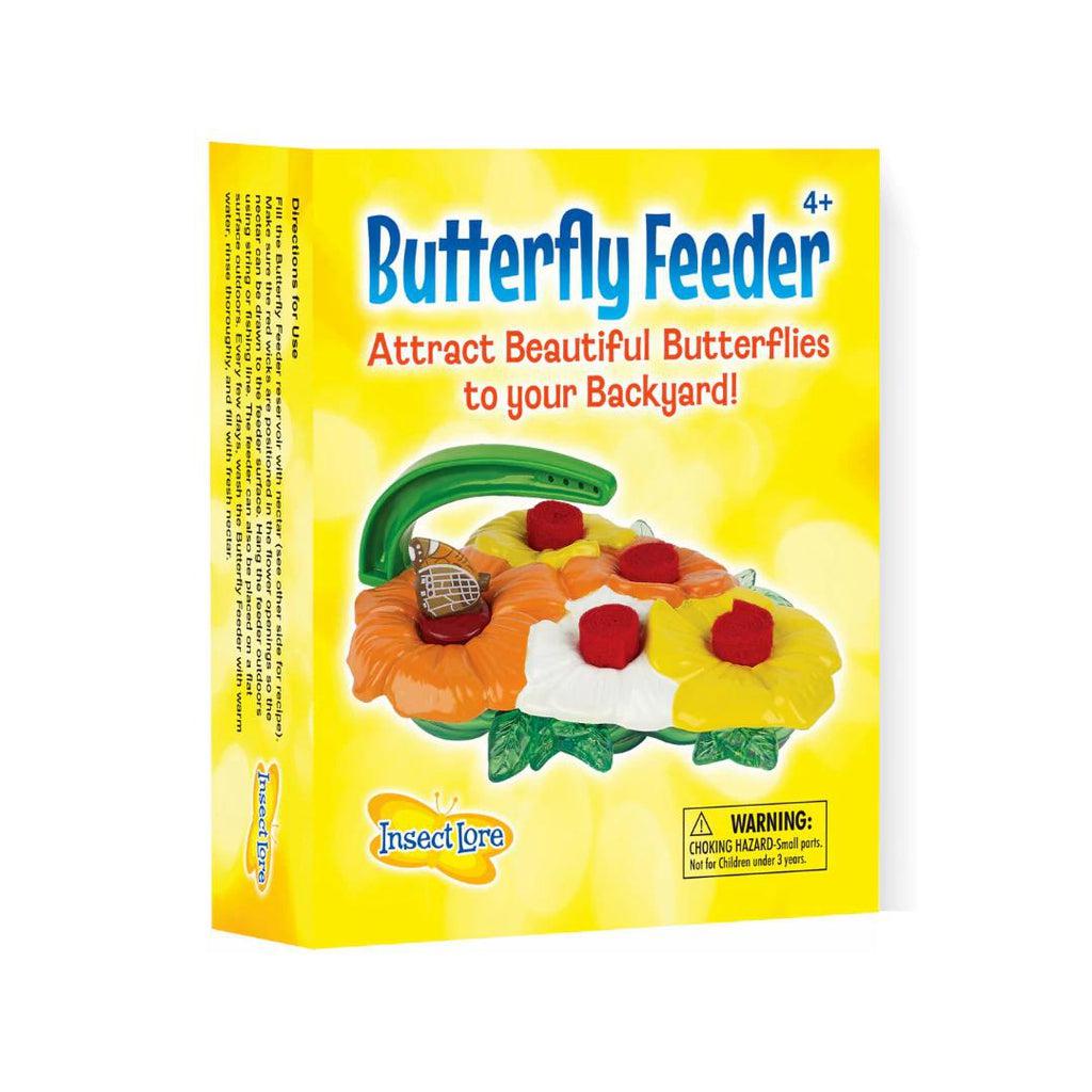 The box for the butterfly feeder shows an image of the feeder which looks like 5 flowers squished together with nectar reservoirs on one and wicks on the other 4. The box reads: Butterfly feeder: Attract beautiful butterflies to your backyard.