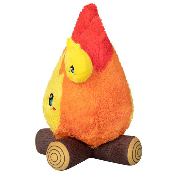 Side view of the plush. Shows that the main fire has a smaller fire buddy attached to the side of the plush.