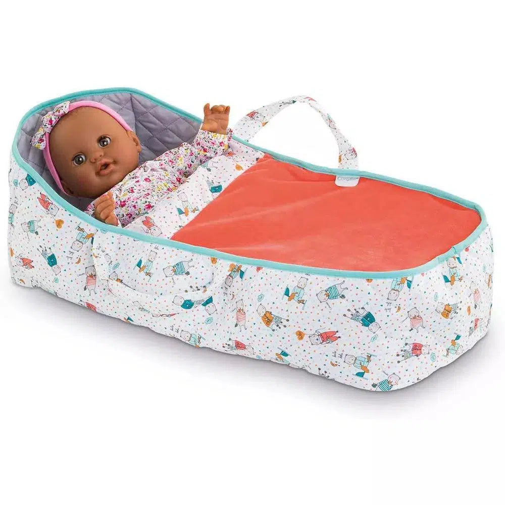 The carry bed is shown with a doll tucked in to it.