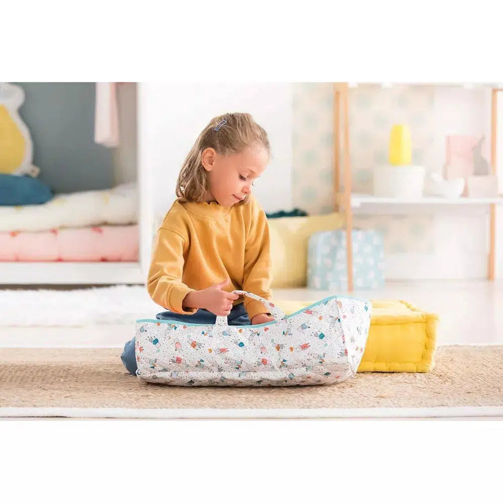 a young girl is shown looking into the carry bed and holding on to one of the straps
