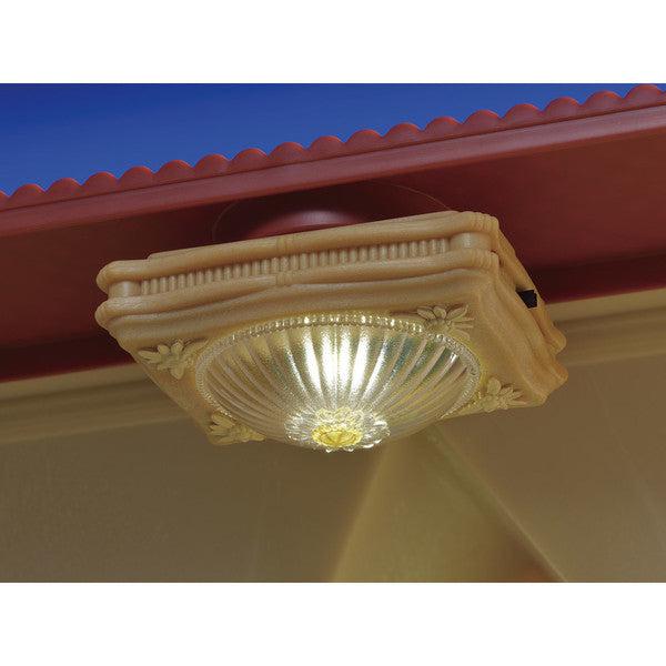 Image of the ceiling light attached in an actual doll house. It has a switch on the side that turns it on and off.