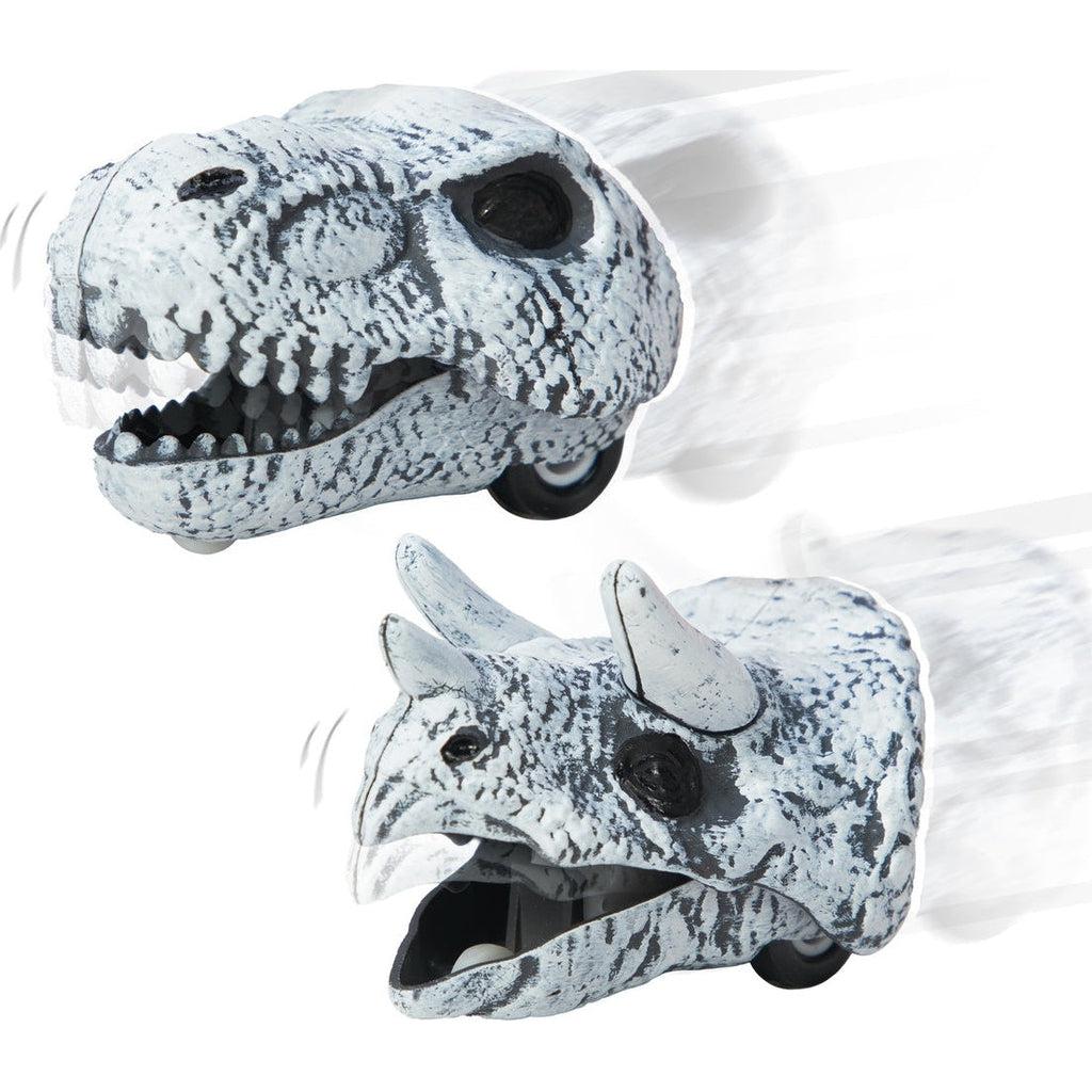 The two versions of the racers are shown. One is a t-rex skull with wheels and the other is a triceratops skull with wheels.