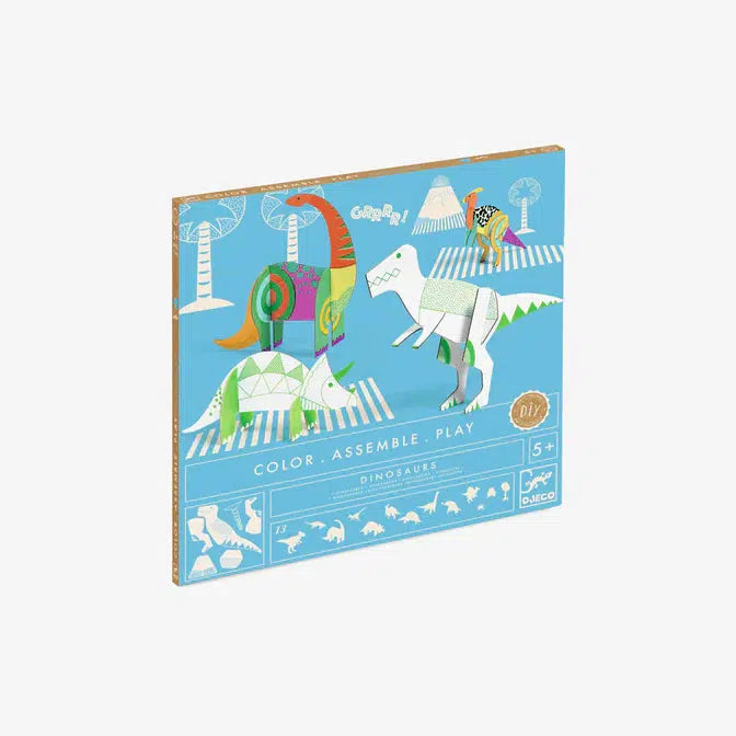 The packaging depicts 4 dinosaurs, a t-rex, a triceratops, a brontosaurus, and a Parasaurolophus, the last two are colored in, while the t-rex and triceratops are yet to be colored. The text below reads: "Color, assemble, play DIY. Dinosaurs, ages 5+ and the djeco logo is in the bottom right corner. Across the bottom is all the dinosaurs that are in the coloring craft book.