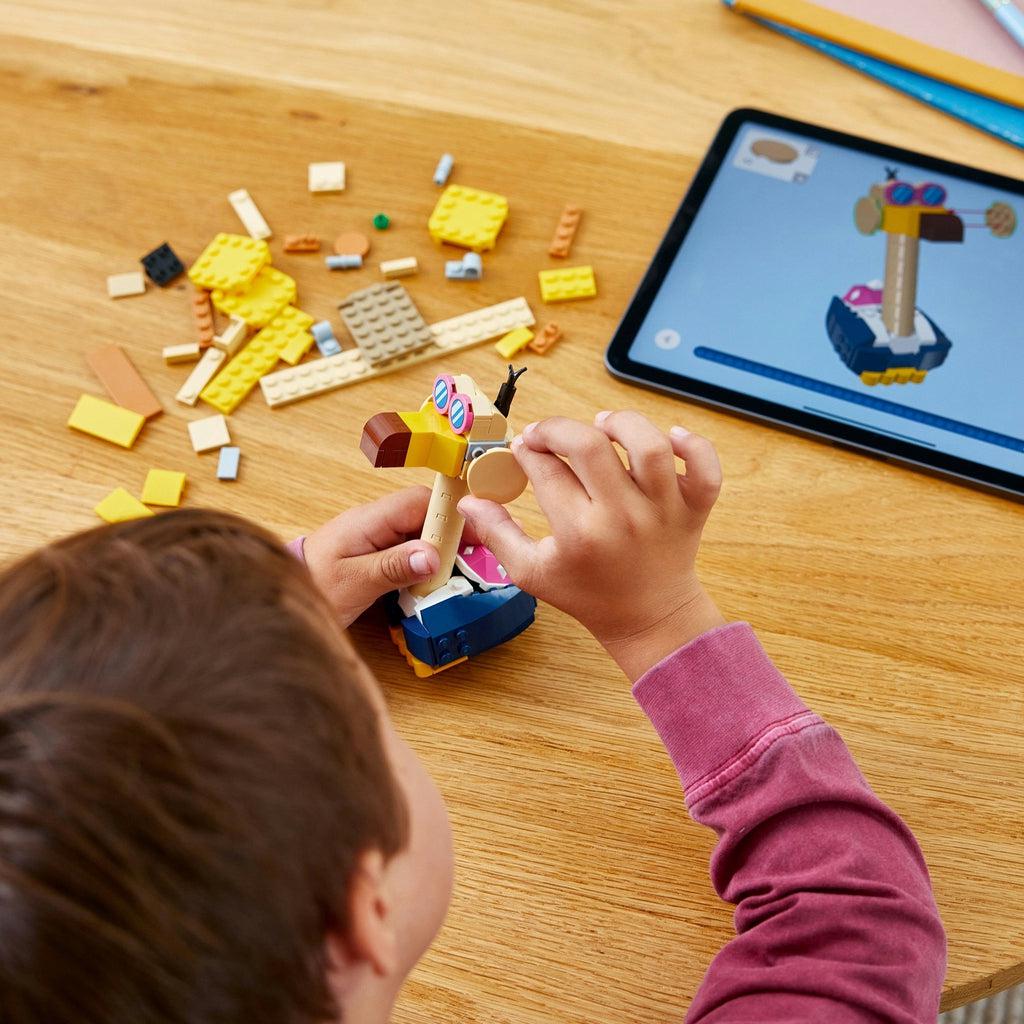 a child is using the lego builder app for instructions on how to build the lego set
