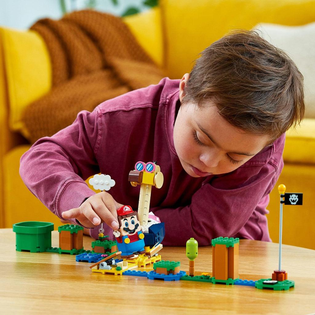 a child is playing with this lego set combined with the lego super mario starter set. The conkdor is in the center of the course between the entrance and the flag pole