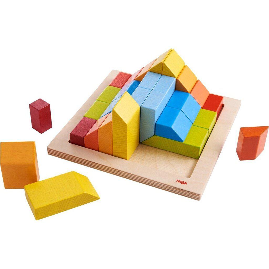 Image of all the included toy pieces. It comes with a wooden base with a lip so the blocks can't slip off. Each color of brick has a different shape from the others and there are 4 of each color of brick. Some of them have an end with a 45 degree angle to them.