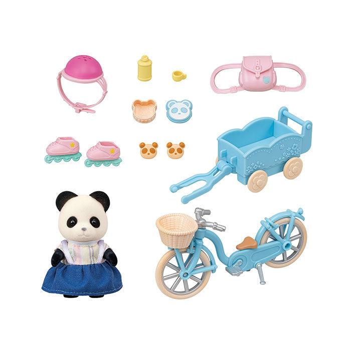 Image of all the individual pieces outside of the packaging. It includes a panda girl character, a baby bicycle with a basket and wagon attachment in the back, a pink backpack, pink roller skates and helmet, and snacks and a water bottle.