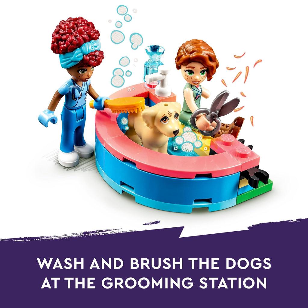 Image shows 2 of the characters grooming one of the dogs in a lego half circle bathtub | Image reads: Wash and brush the dogs at the grooming station.