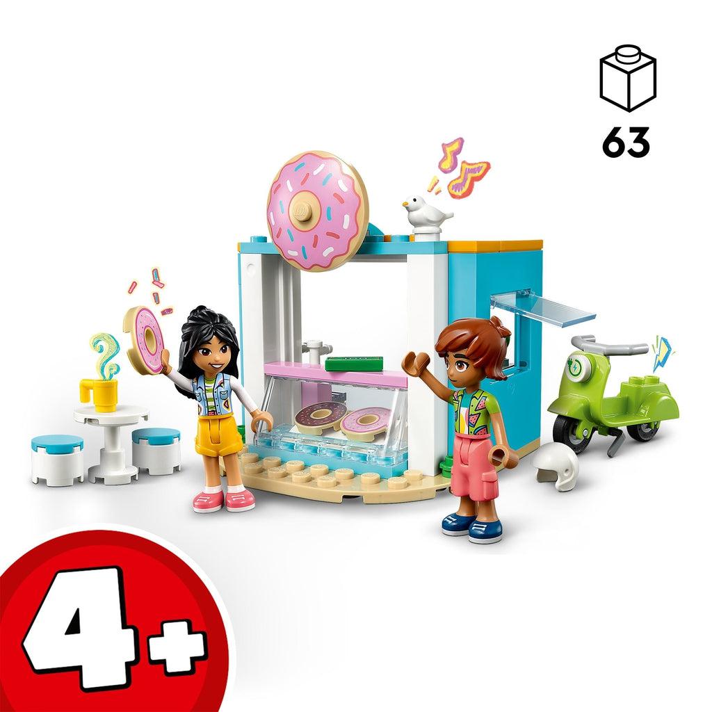 Image shows one lego character waiving to the other who is holding up a donut in front of the lego donut shop | Piece count of 63 in top left | age recommendation of 4+ in bottom left