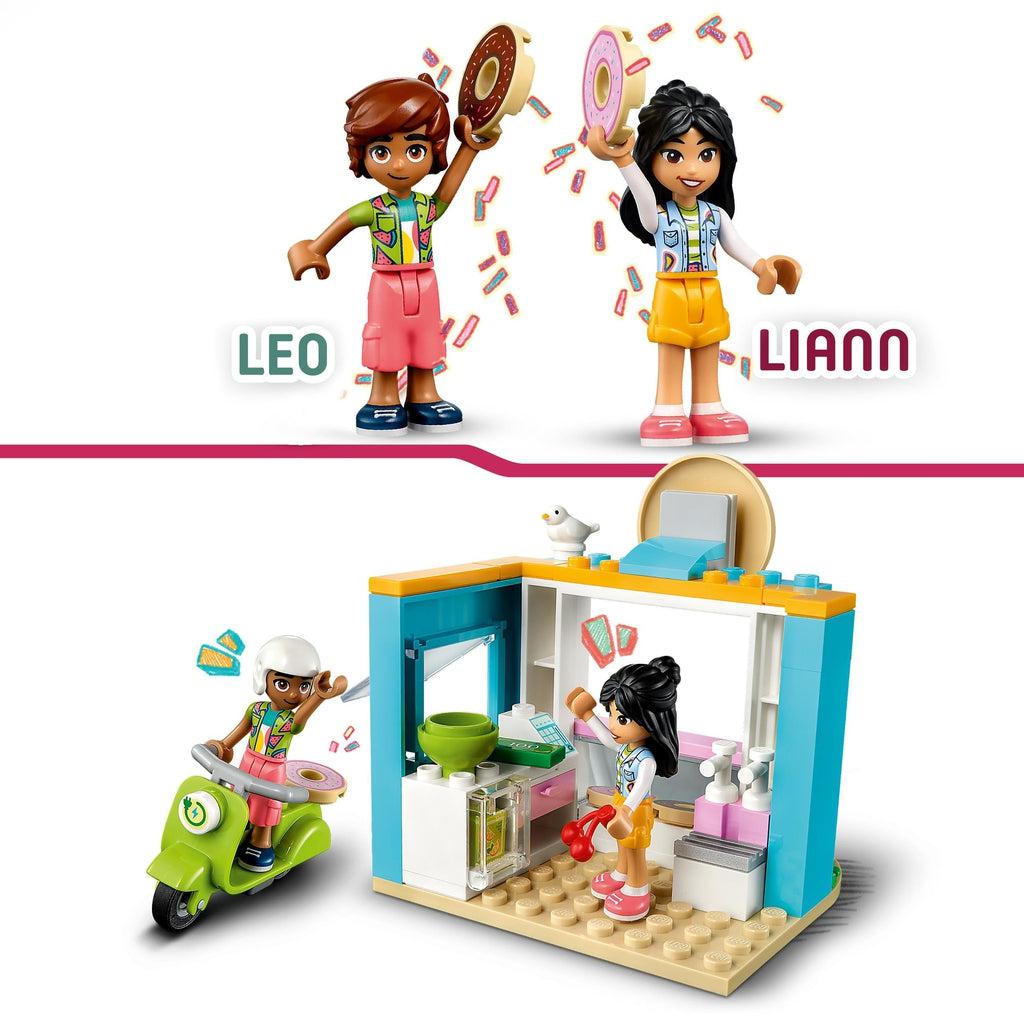 top image shows the two lego friends Leo and Liann both holding up lego donuts | bottom image shows leo riding the motor scooter waving to liann through the drive through window on the shop.