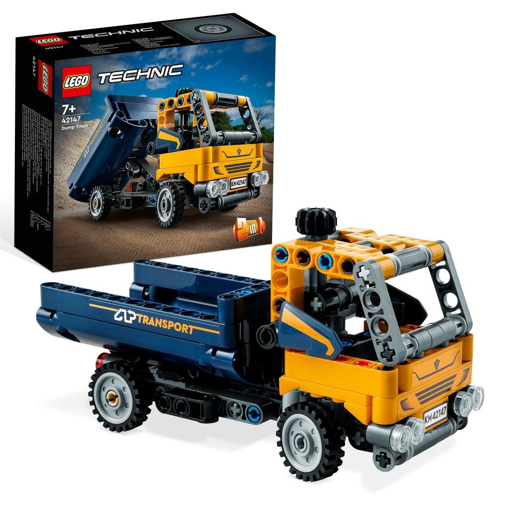The lego dump truck is displayed in front of its box | It's a dump truck with an orange cab and a blue bed with "transport" written on the side