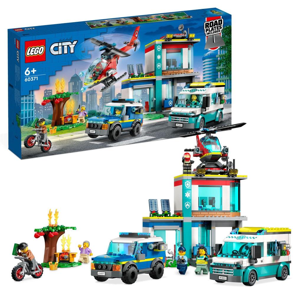 The lego set is shown in front of the box | There are two trucks, a helicoptor, a bike, a 2 story rescue service building, a tree and barbeque with lego "fires" on it, and 5 lego minifigures
