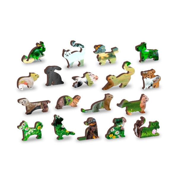 Examples of unique piece shapes pulled from puzzle | Example pieces shown are a variety of animal shapes including dogs, cats, birds, fish, and reptiles.