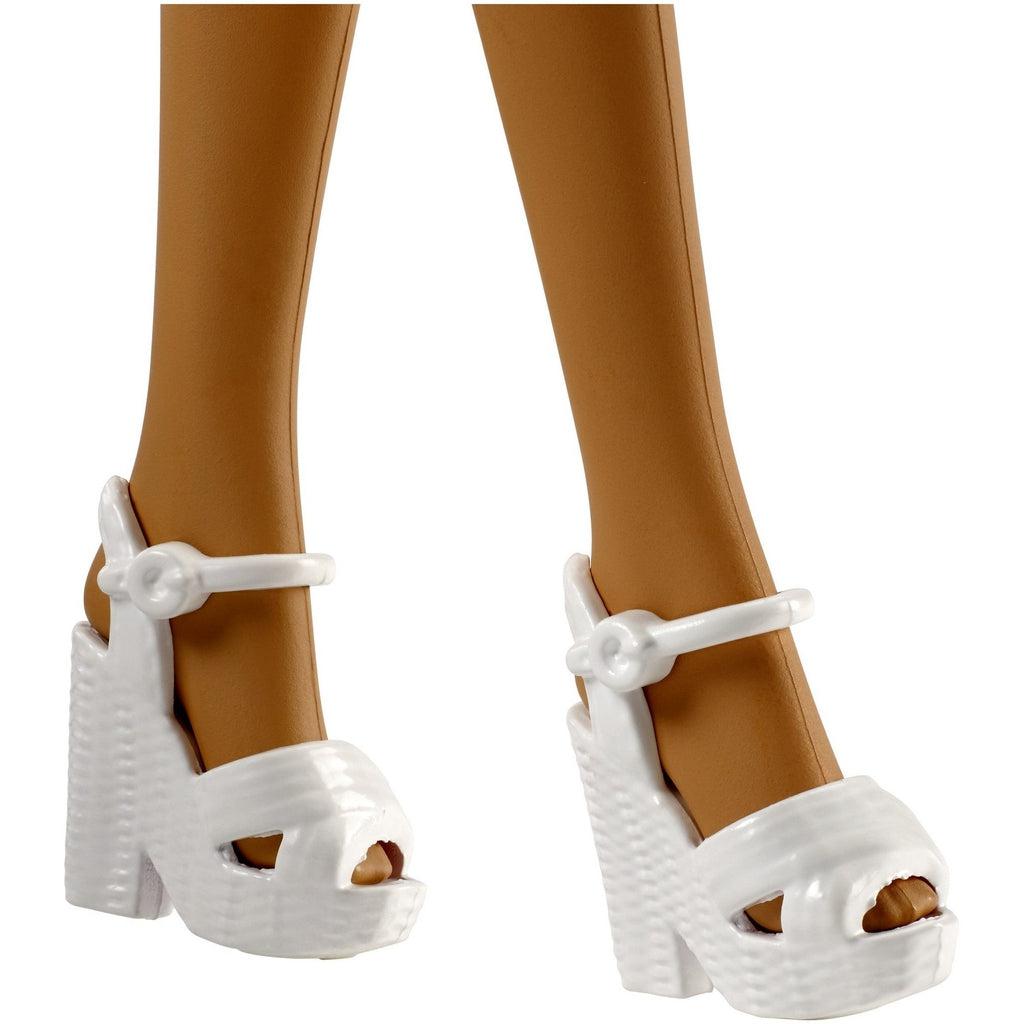 Close up of shoes | White heeled wedges with textured bases.