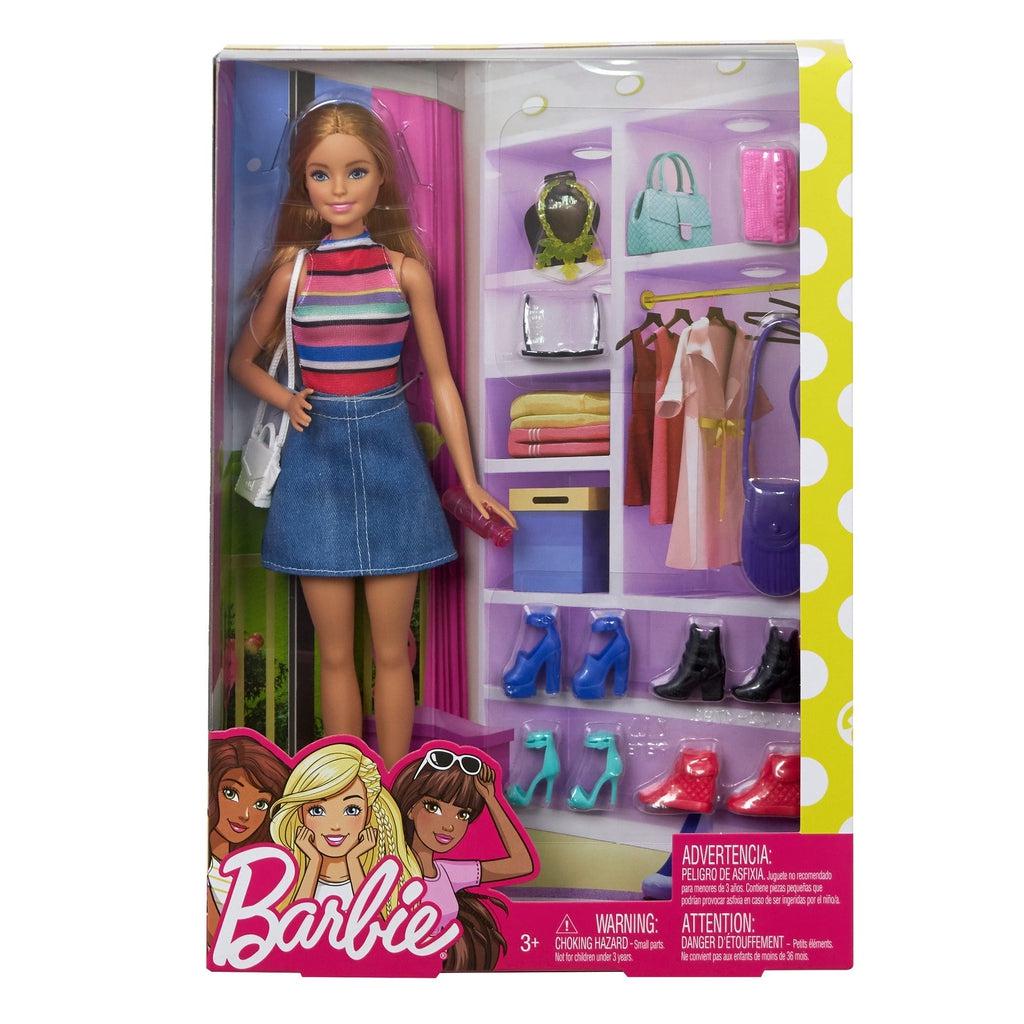 Barbie in packaging | Packaging is transparent and background looks like the inside of a closet.