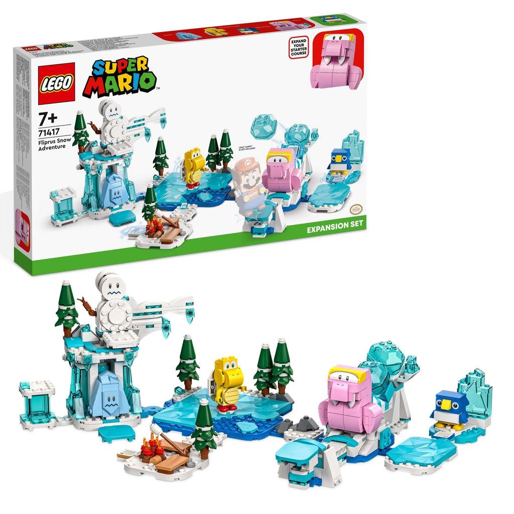 the lego set is shown in front of its box | There is a lego fliprus (a pink walrus creature), a freezie, a penguin, and a red koopa troopa on an ice themed setting with a snowman