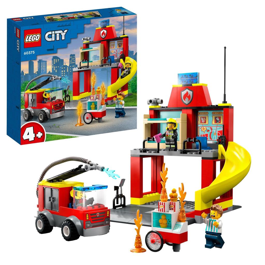 The lego set is shown in front of its box | there is a lego fire truck with a hose, a popcorn stand "on fire", a 2 story fire station with a slide, and 3 minifigures