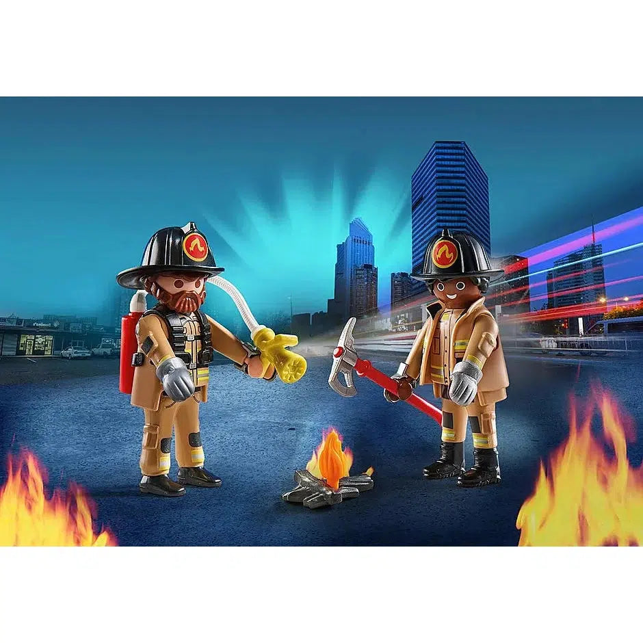 One playmobil firefighter holds a hose connected to a tank on his back, the other holds a long fire axe. Both are wearing firemans hats and uniforms
