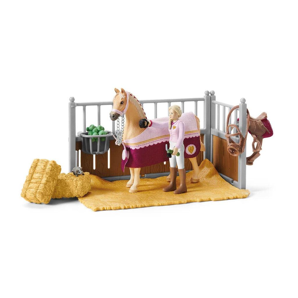 The set comes with a horse stable complete with hay and grooming tools.