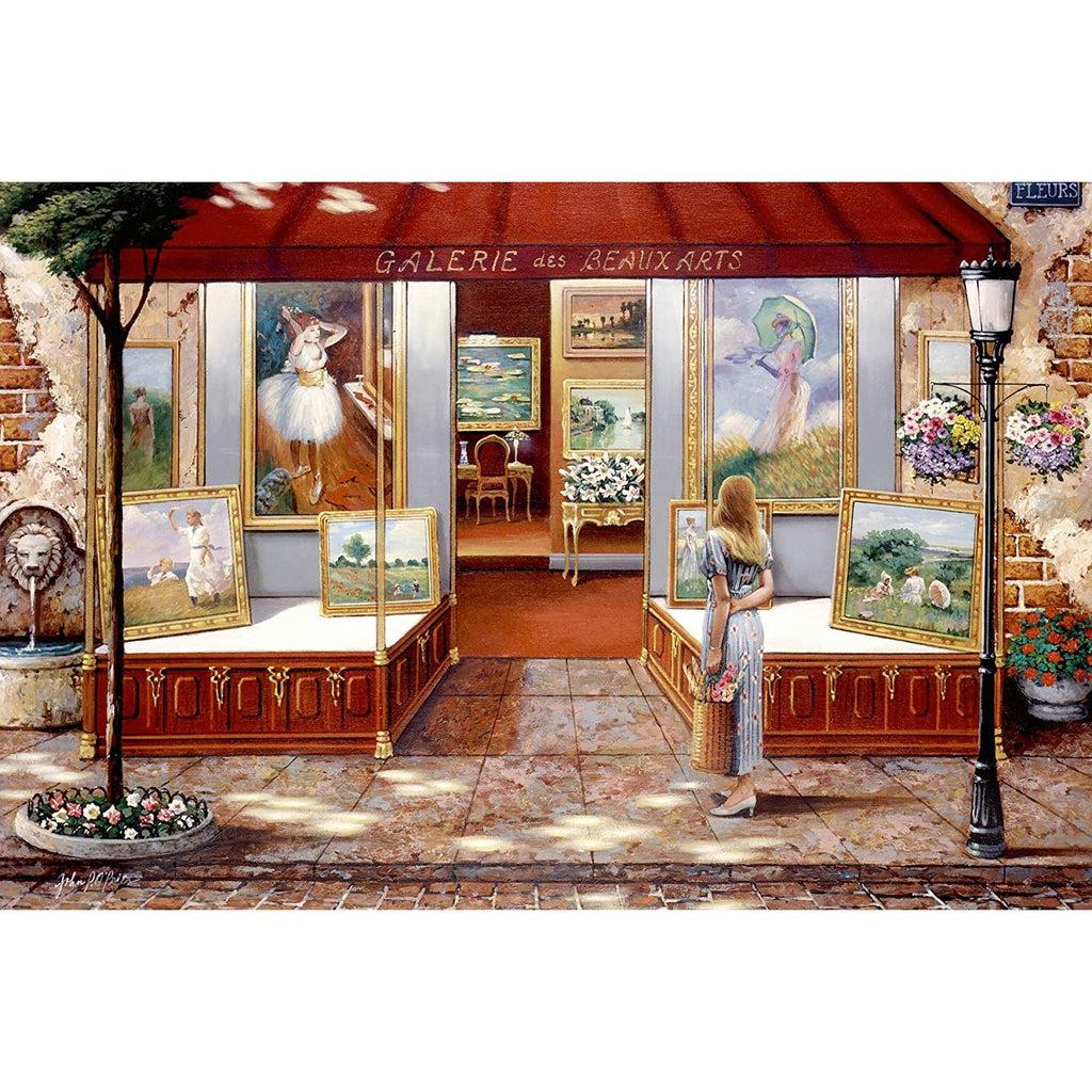 The puzzle is a picture of a girl gazing at the window displays for the Gallery of Fine Art in a Parisian town. There are many famous paintings shown such as Monet's Water Lilies.