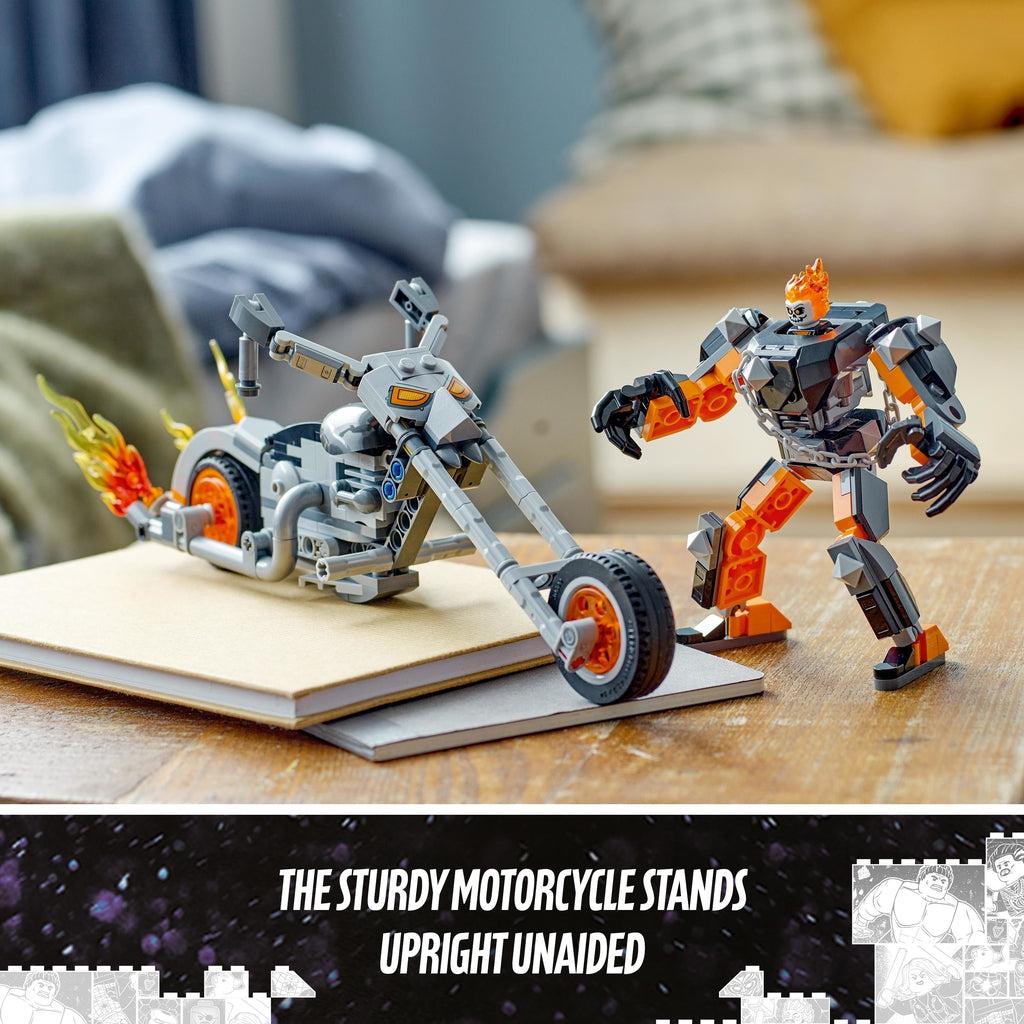 The mech with the figure inside it is standing on a table next to the motorcycle | image reads: The sturdy motorcycle stands upright unaided