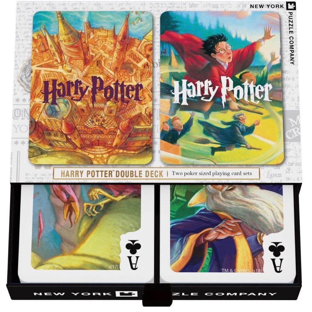 Image of the box sightly slid open so you can see part of the top two card in the decks. Shows that there is a different illustration of Harry Potter related people and places on each card face.