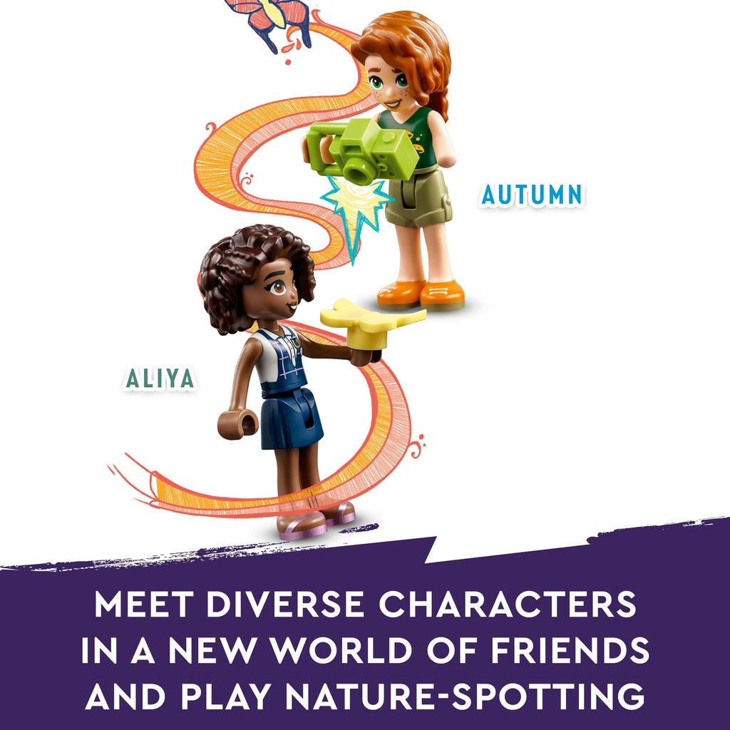 Image shows the lego friend Autumn holding a lego camera pointed at aliya who is holding a lego butterfly on her hand. | Image reads: Meet diverse characters in a new world of friends and play nature-spotting.