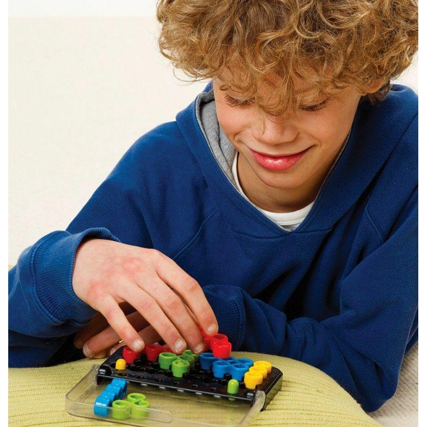 a young boy smiles while playing the game