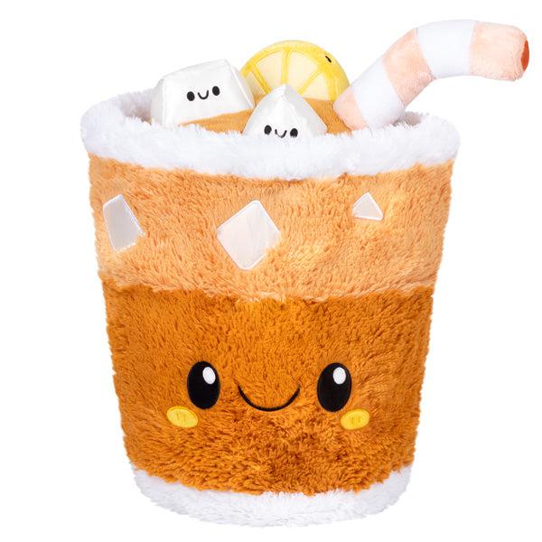 Image of the Iced Tea squishable. It is a fluffy iced tea drink plush with a cute face, ice cubes, and a straw.
