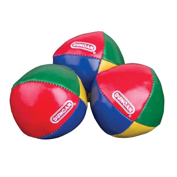 The three juggling balls are shown close up. They are each made out of 4 different colored segments, red, green, blue, and yellow. The duncan logo is on the red segment of each of the balls.