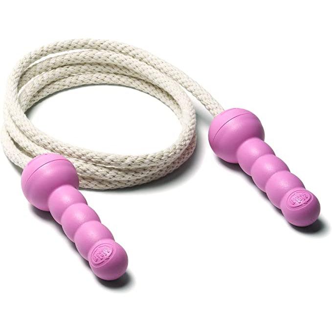 The jumprope out of the box is coiled up on a white background. The handles are pink and are shaped like 3 small balls connected to a larger one at the top which connects to the rope.