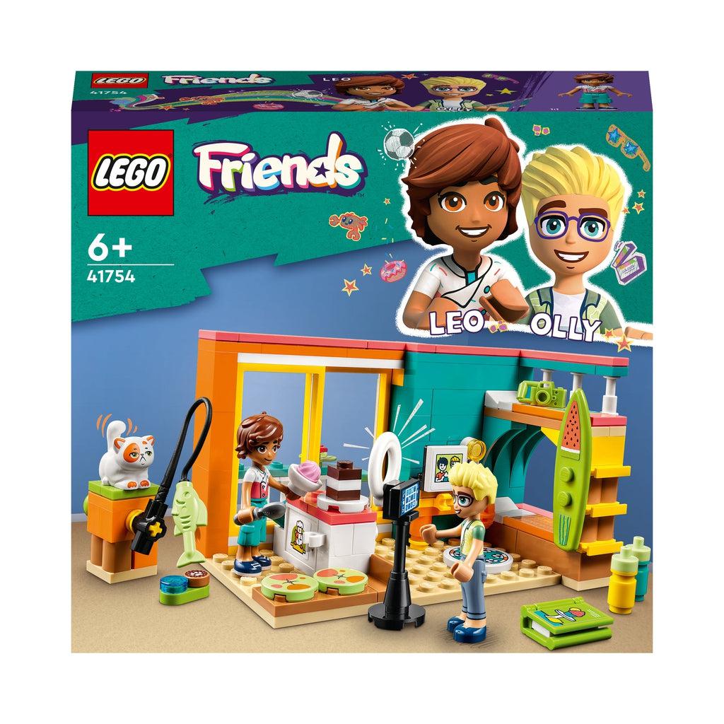 The box shows two lego friends figures ina beach themed room with a kitchen attached where the two figures are recording a cooking video | Also a lego cat is shown on top of a perch with a fish toy to play with.