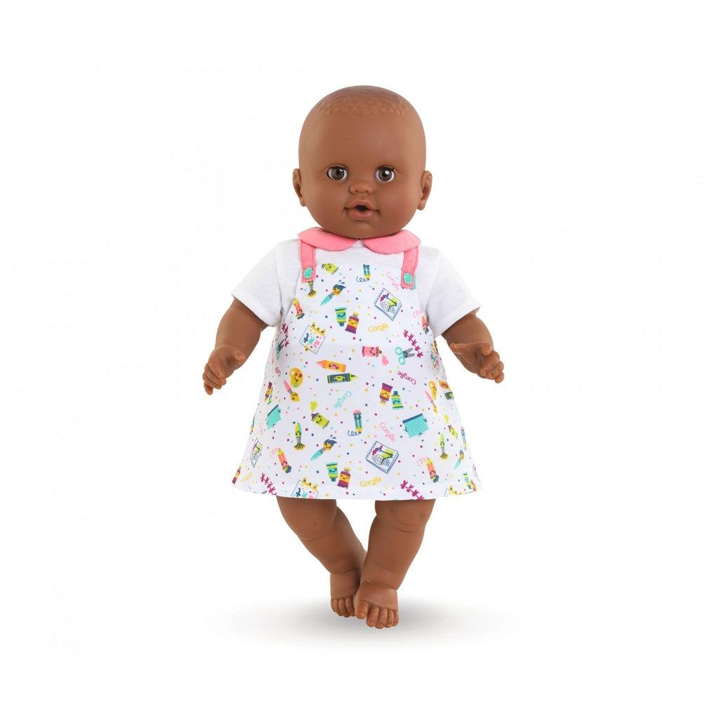 A baby doll is shown wearing the dress