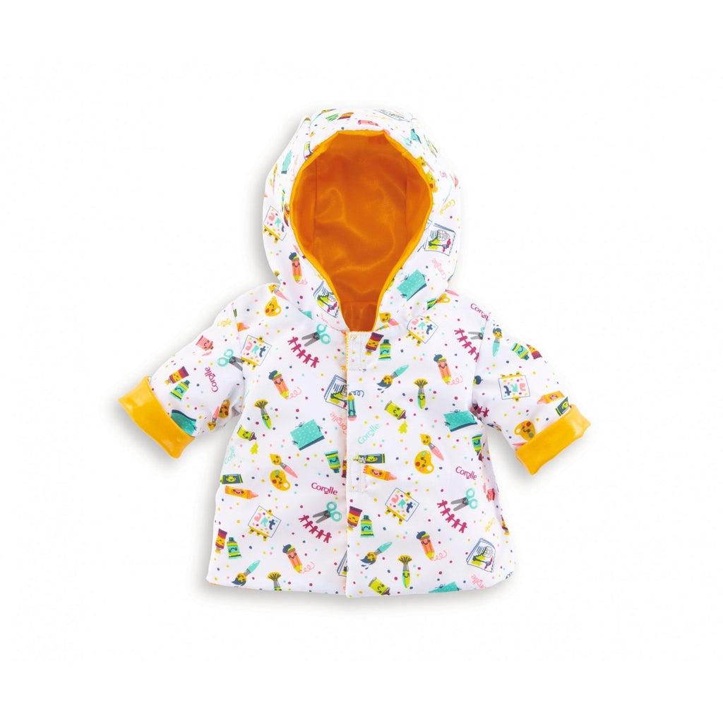 The reversed side of the raincoat is white with cartoon art supplies printed all over it, the inside and sleeve cuffs are yellow.