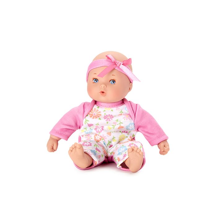 Doll with light skin tone. | Doll is wearing a pink bow and pink onesie with a flower printed white front panel.
