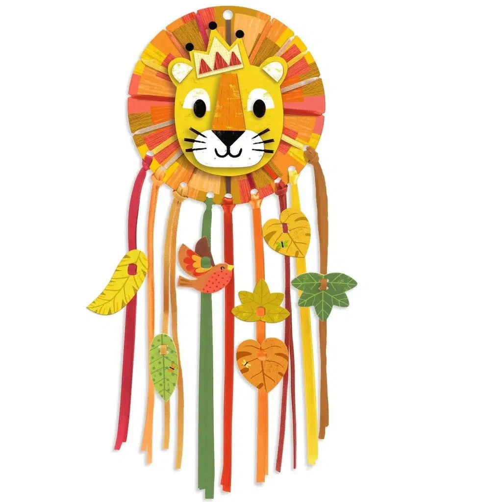 Image of a possible finished product. The lion's head has holes at the bottom holding ribbons of different colors.