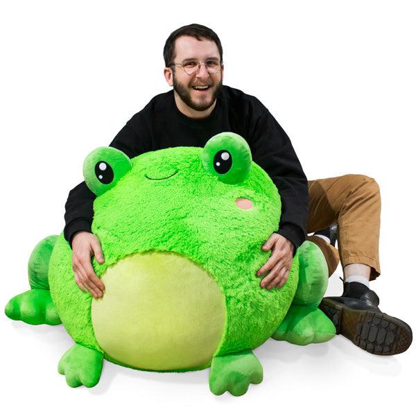 Image of the Massive Frog squishable. It is a giant green frog with a lighter color belly and cute blush marks.