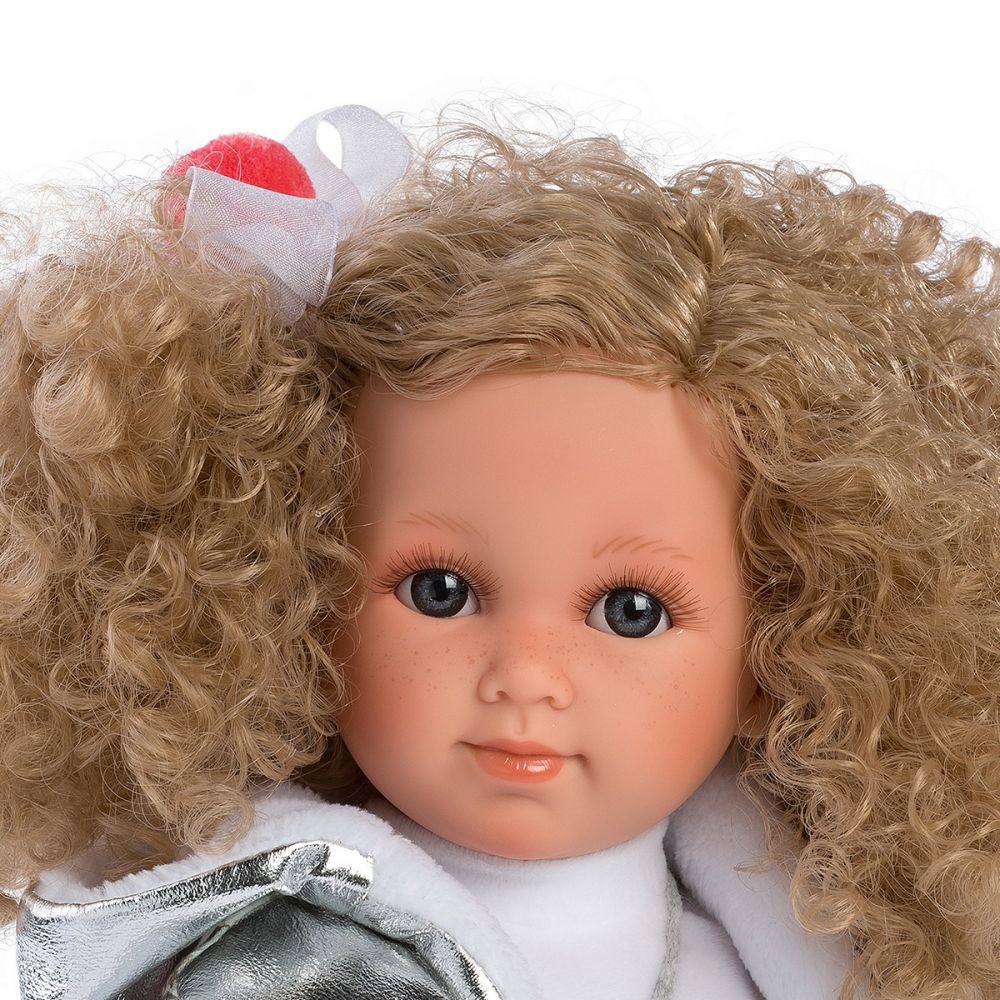 Close up of dolls face | The doll has painted on blonde eyebrows and long blonde realistic eyelashes.