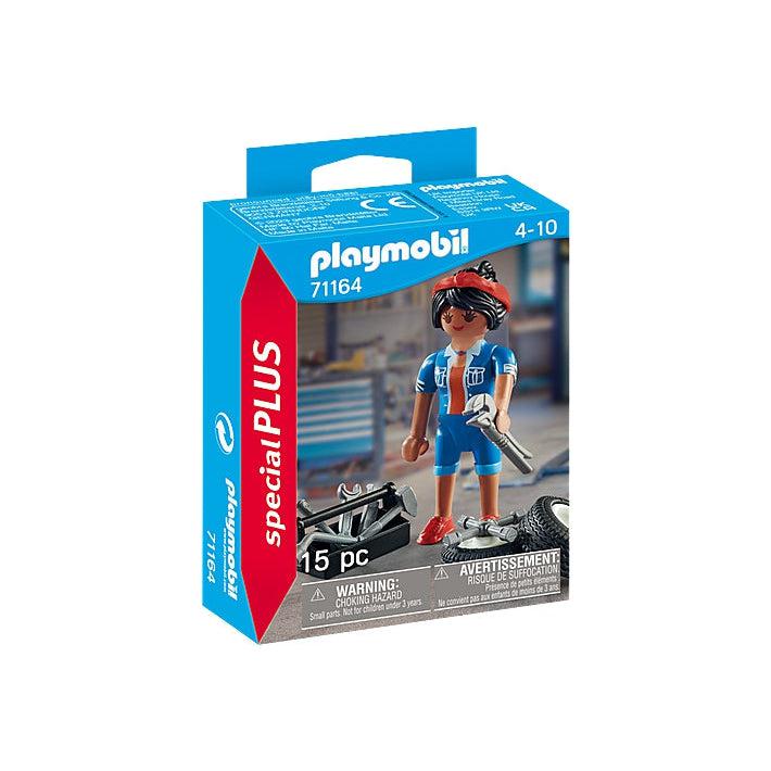 The cover of the smallish box shows the woman mechanic figure in a blue mechanics outfit holding a wrench next to a tool box and some tires