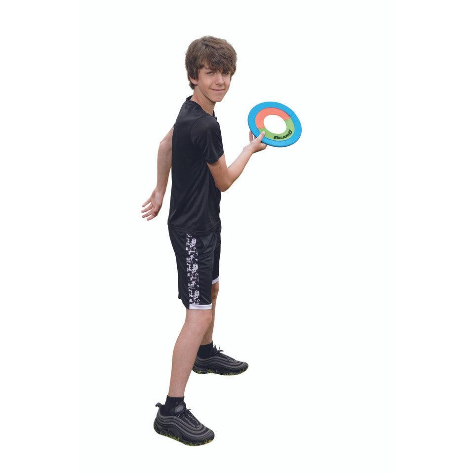 A boy prepares to throw the beamo like a frisbee