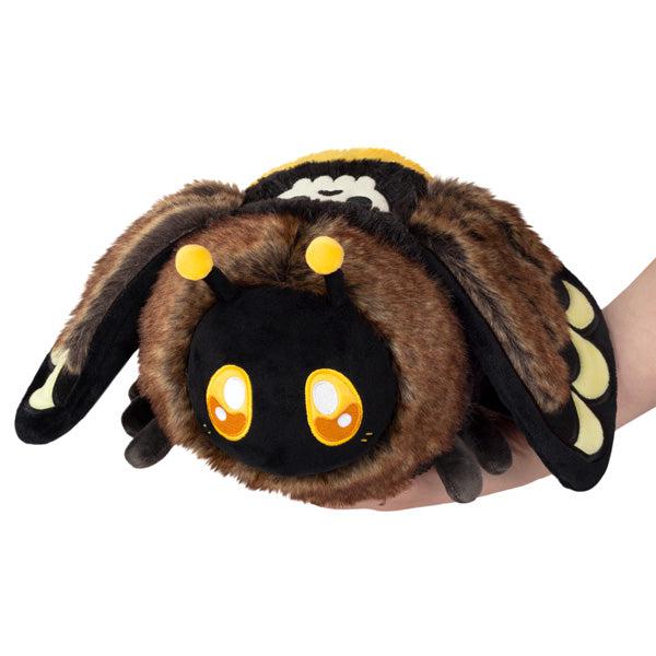 Imgae of the Mini Death's-Head Hawkmoth squishable. It is a dark brown and black bee-looking creature with honey colored eyes.