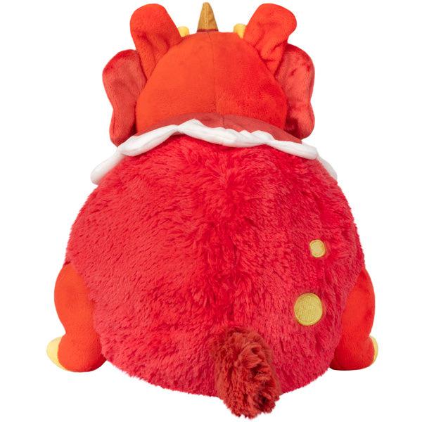 Back view of the plush. Shows that there are some yellow emboridered spots on its back. It also has a darker red tail.
