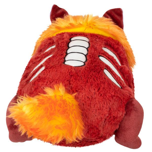 Back view of the plush. Shows that it has an fiery orange tail.