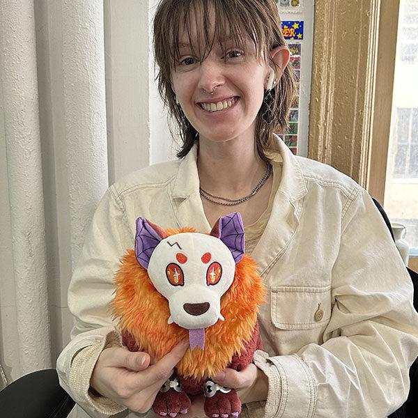 Scene of a woman holding the plush.