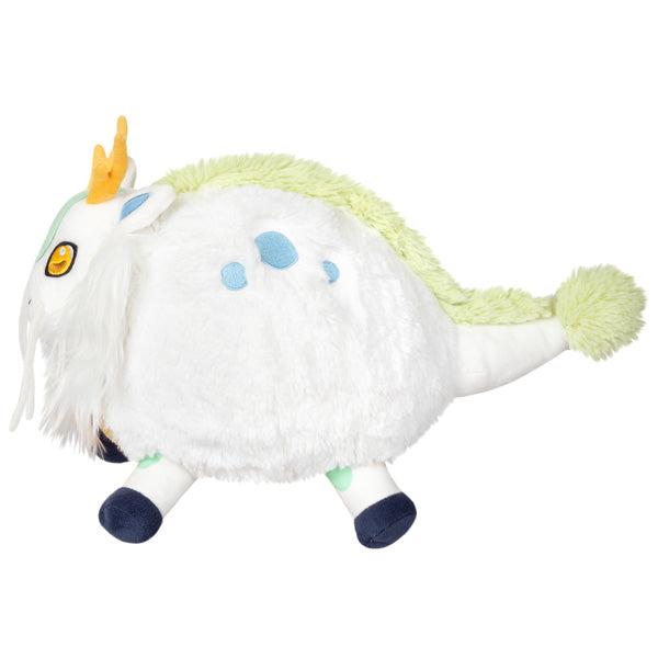 Side view of the plush. Shows that the plush has a white beard, black hooves, yellow antlers, and blue embroidered spots on its sides.
