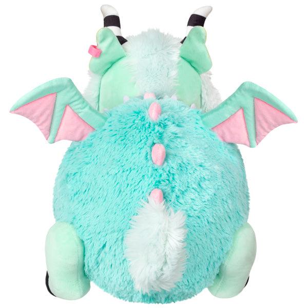 Back view of the plush. Shows that it has pink spine spikes and a light mint fluffy tail.