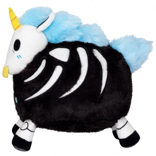 Side view of the plush. You can see the unicorn's ribs, collarbone, and patella through embroidery.